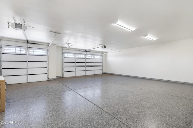 20111 W Saguaro Vista Dr, Wittmann, AZ 85361 - garage featuring baseboards and a garage door opener