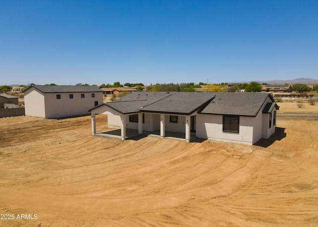 20111 W Saguaro Vista Dr, Wittmann, AZ 85361 - back of house featuring stucco siding and a tile roof