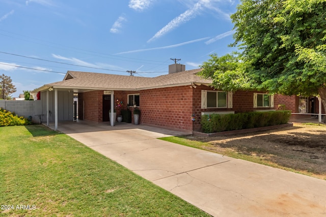 ranch-style house with a front lawn and a carport