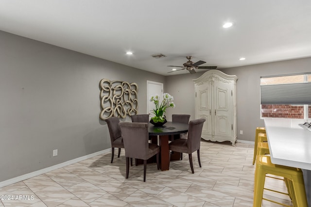 dining area featuring light tile patterned flooring and ceiling fan