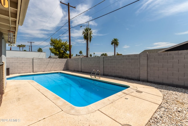 view of pool featuring a patio