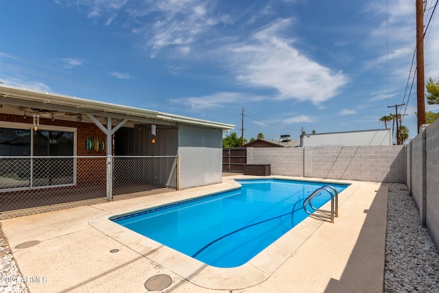 view of pool featuring a patio and ceiling fan