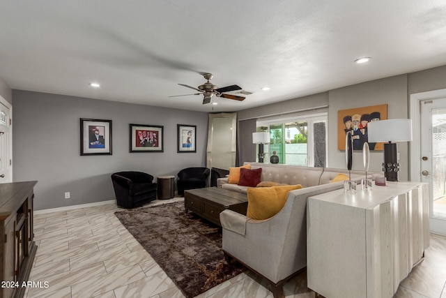 living room featuring ceiling fan and light tile patterned floors