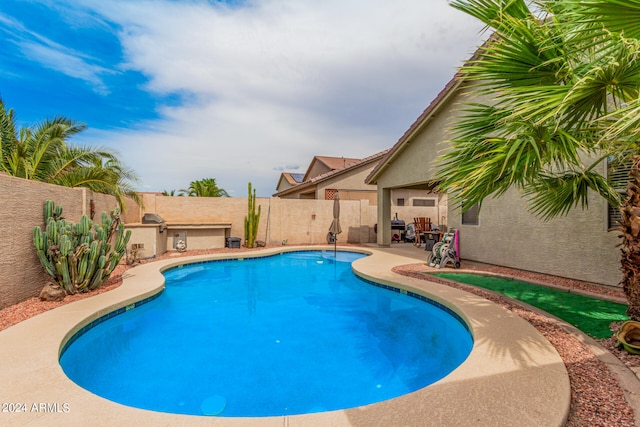 view of swimming pool featuring a patio area