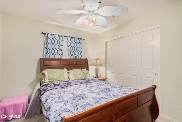 bedroom with ceiling fan, a closet, and carpet floors