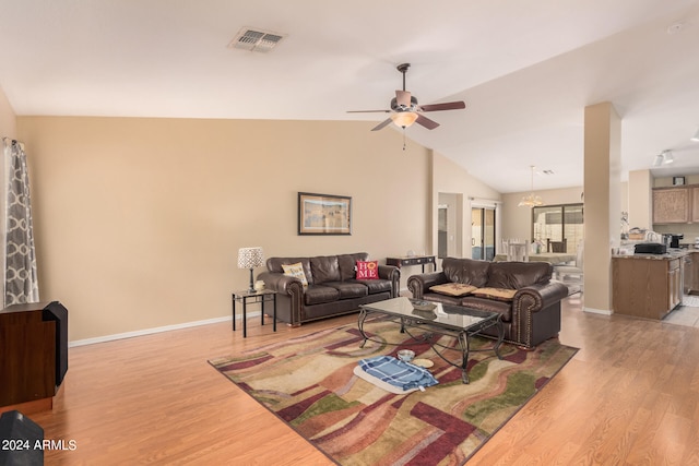 living room featuring light wood-type flooring, high vaulted ceiling, and ceiling fan