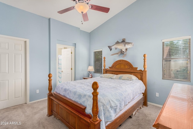 carpeted bedroom featuring ceiling fan and vaulted ceiling