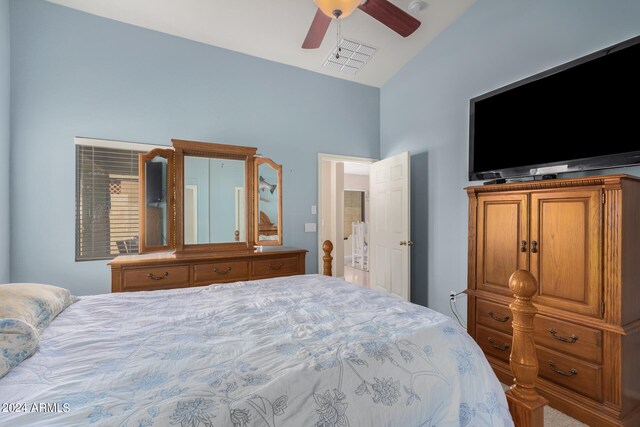 bedroom featuring ceiling fan and high vaulted ceiling