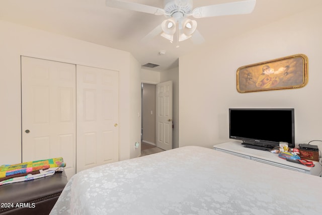 bedroom with carpet, ceiling fan, and a closet