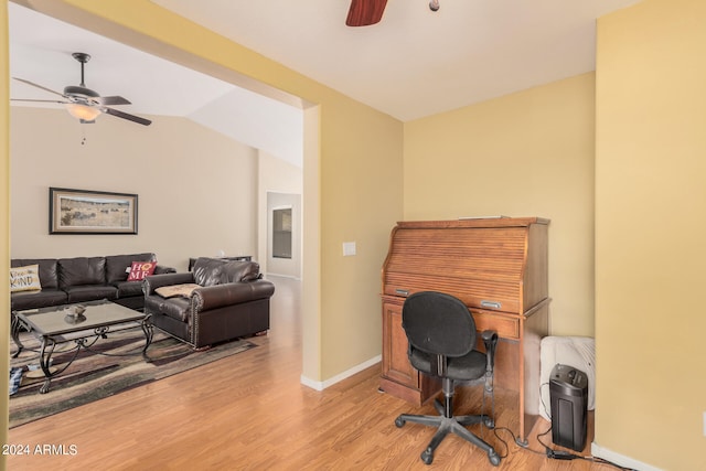 home office with light wood-type flooring, ceiling fan, and lofted ceiling