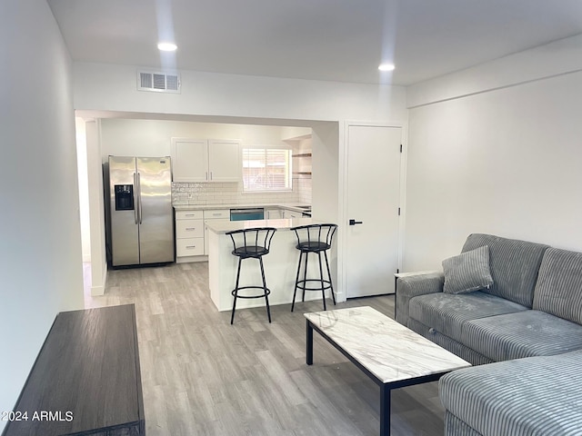 living room with light hardwood / wood-style flooring