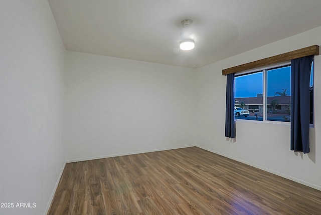 3054 W Redfield Rd, Phoenix, AZ 85053 - empty room with dark wood-style floors and baseboards