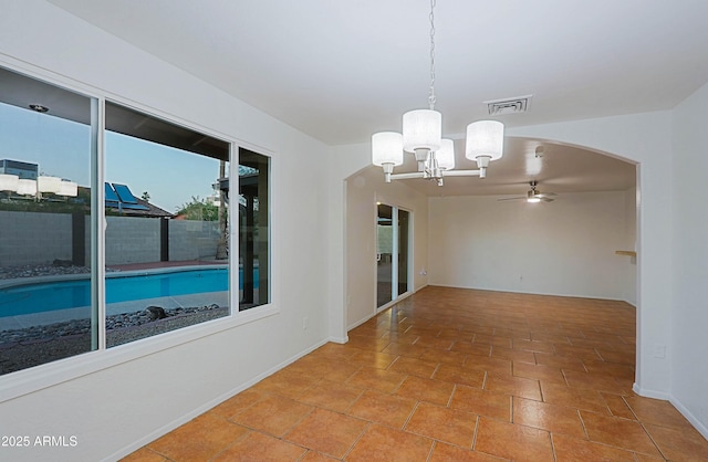 3054 W Redfield Rd, Phoenix, AZ 85053 - empty room featuring a ceiling fan, a chandelier, arched walkways, and baseboards