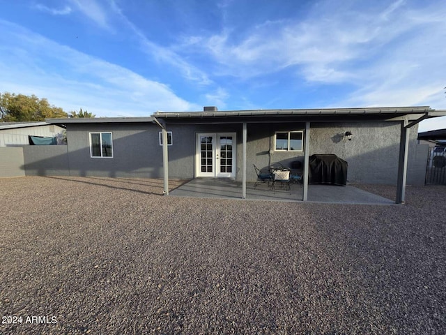 back of house with a patio area and french doors