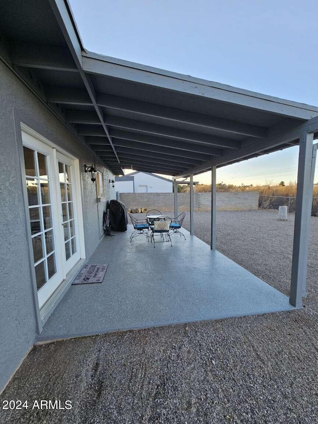 view of patio with french doors and a grill