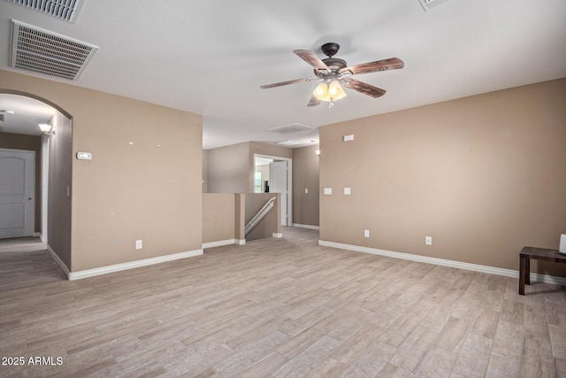 spare room featuring ceiling fan and light wood-type flooring