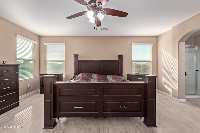 bedroom with ceiling fan and light wood-type flooring