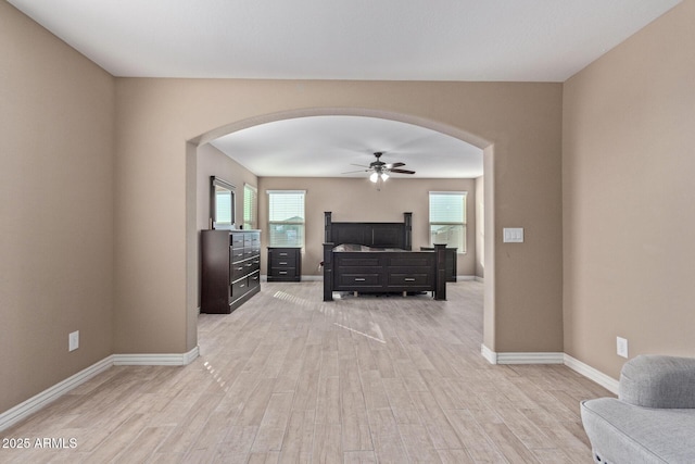 living room featuring light hardwood / wood-style floors and ceiling fan