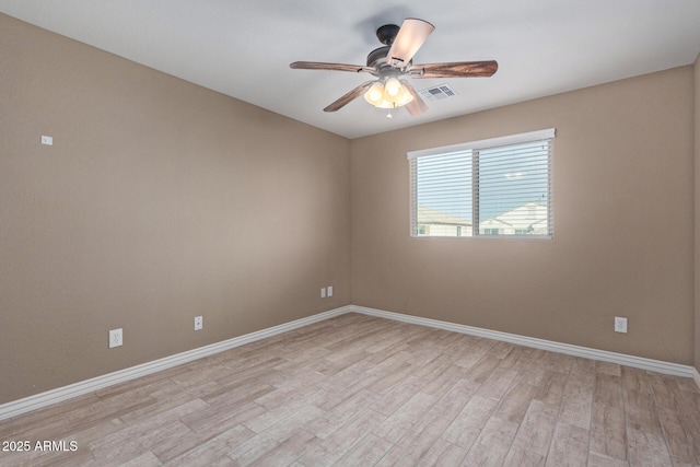 spare room with ceiling fan and light hardwood / wood-style flooring