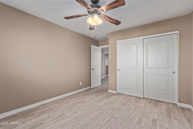 unfurnished bedroom with light wood-type flooring, a closet, and ceiling fan