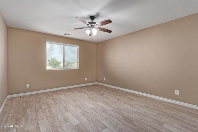 spare room with ceiling fan and light hardwood / wood-style flooring