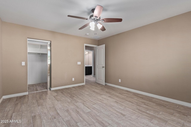 unfurnished bedroom with ceiling fan, a closet, and light hardwood / wood-style floors