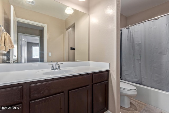 full bathroom featuring vanity, toilet, and shower / bath combo with shower curtain