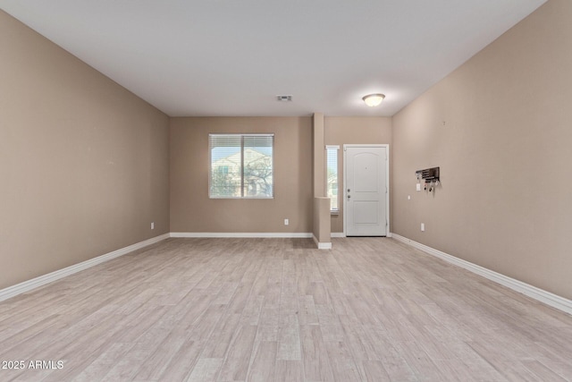 entryway with light hardwood / wood-style floors