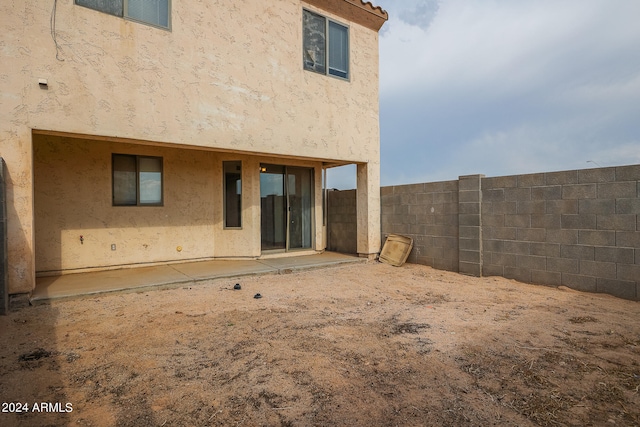 rear view of property featuring a patio area