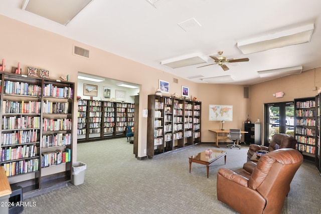 living area featuring carpet