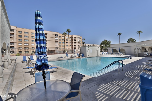 view of pool featuring a patio