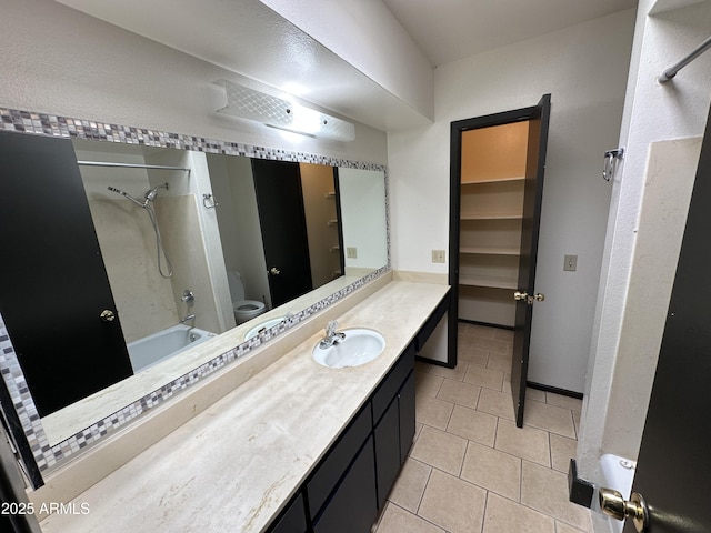220 S Old Litchfield Rd Unit 104, Litchfield Park, AZ 85340 - full bathroom featuring tile patterned flooring, toilet, vanity, and shower / bathtub combination