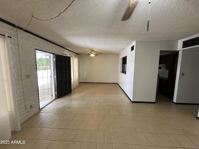 220 S Old Litchfield Rd Unit 104, Litchfield Park, AZ 85340 - unfurnished room with a ceiling fan, a textured ceiling, and baseboards