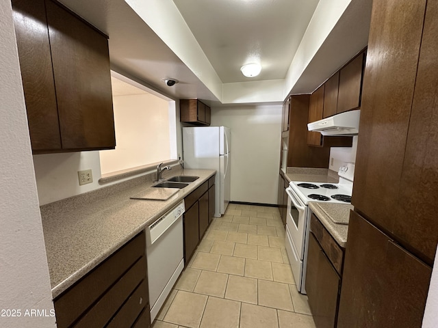 220 S Old Litchfield Rd Unit 104, Litchfield Park, AZ 85340 - kitchen with white appliances, under cabinet range hood, a sink, and dark brown cabinets