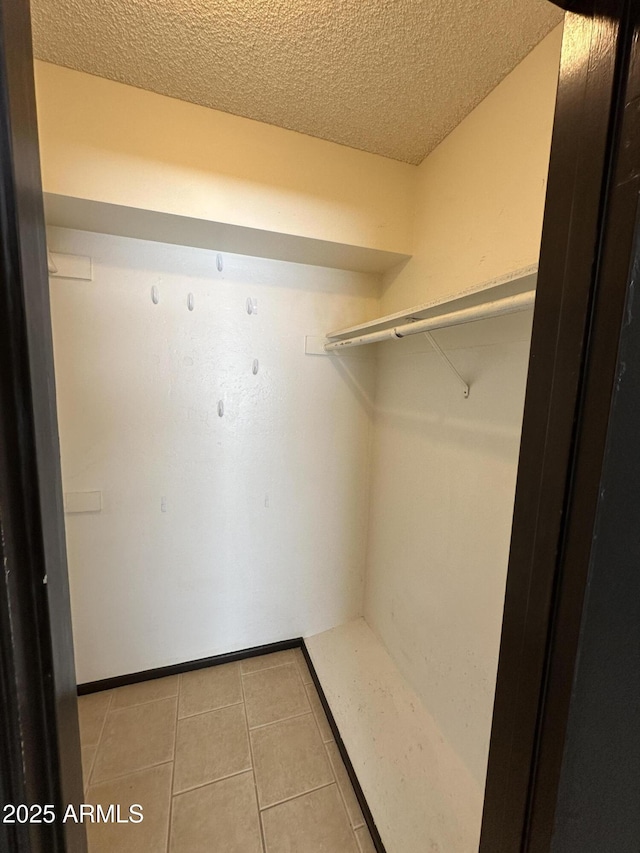 220 S Old Litchfield Rd Unit 104, Litchfield Park, AZ 85340 - spacious closet featuring tile patterned flooring