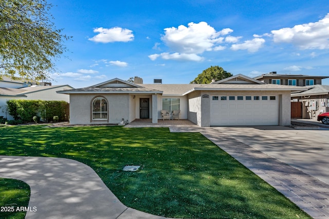 view of front facade with a garage and a front lawn