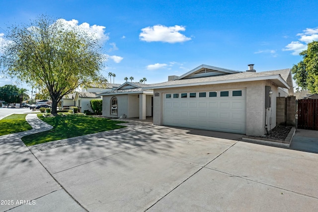 ranch-style home with a garage and a front yard