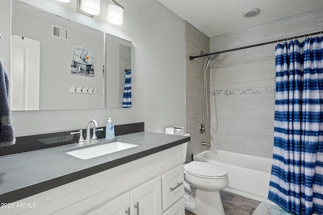 full bathroom featuring vanity, toilet, and shower / bath combo with shower curtain