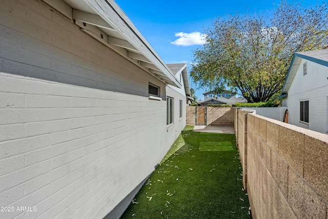 view of side of home featuring a yard