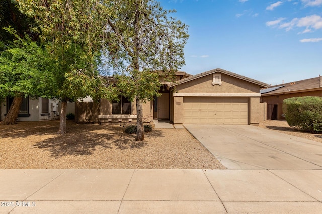 2590 S Buckaroo Trl, Gilbert, AZ 85295 - view of front of home with an attached garage, driveway, and stucco siding