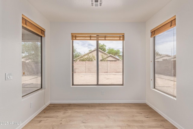 2590 S Buckaroo Trl, Gilbert, AZ 85295 - empty room featuring light wood-type flooring and baseboards