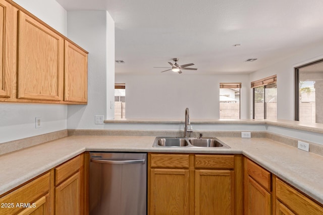 2590 S Buckaroo Trl, Gilbert, AZ 85295 - kitchen featuring dishwasher, a sink, a ceiling fan, and light countertops