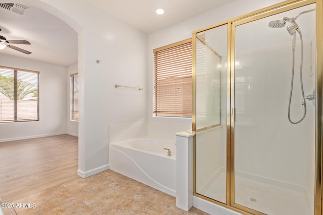 2590 S Buckaroo Trl, Gilbert, AZ 85295 - full bath with a shower stall, a garden tub, ceiling fan, baseboards, and recessed lighting