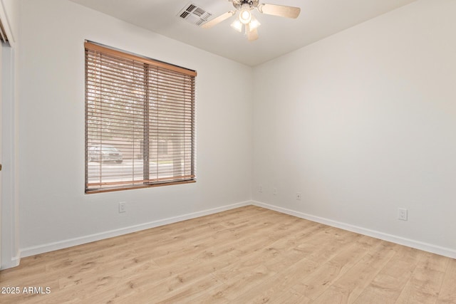 2590 S Buckaroo Trl, Gilbert, AZ 85295 - spare room with wood finished floors, baseboards, and ceiling fan