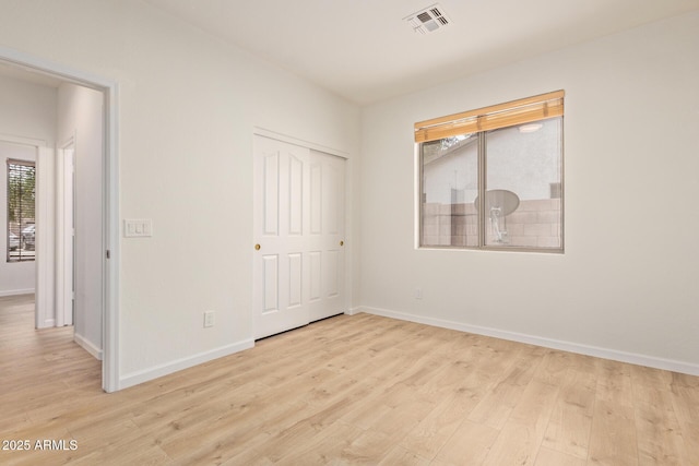 2590 S Buckaroo Trl, Gilbert, AZ 85295 - unfurnished bedroom with light wood finished floors and baseboards