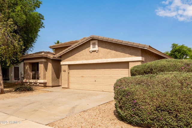 2590 S Buckaroo Trl, Gilbert, AZ 85295 - view of front of home featuring stucco siding, an attached garage, driveway, and a tiled roof