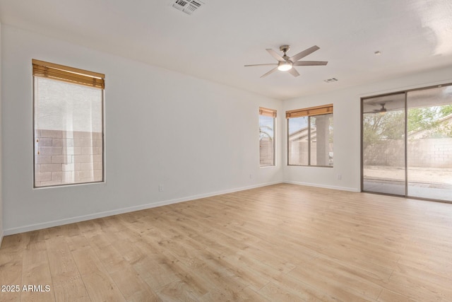 2590 S Buckaroo Trl, Gilbert, AZ 85295 - empty room with ceiling fan, light wood-type flooring, and baseboards