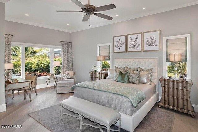 bedroom with ceiling fan, ornamental molding, and light hardwood / wood-style flooring