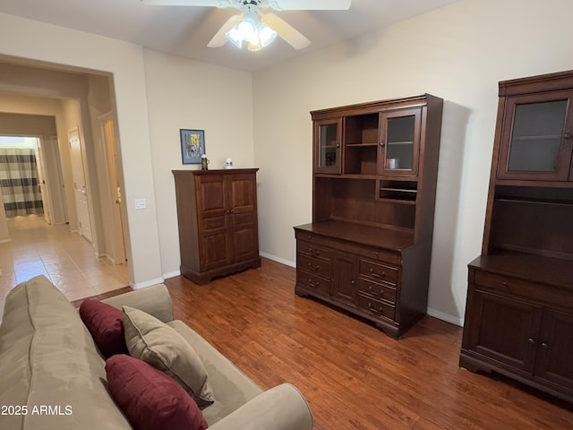 living room with hardwood / wood-style floors and ceiling fan