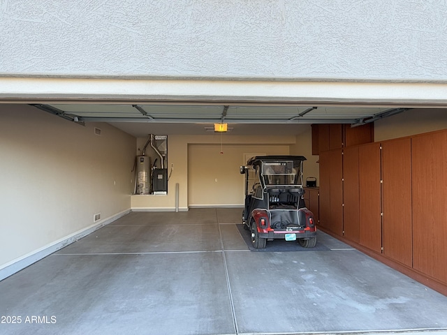 garage with a garage door opener and gas water heater